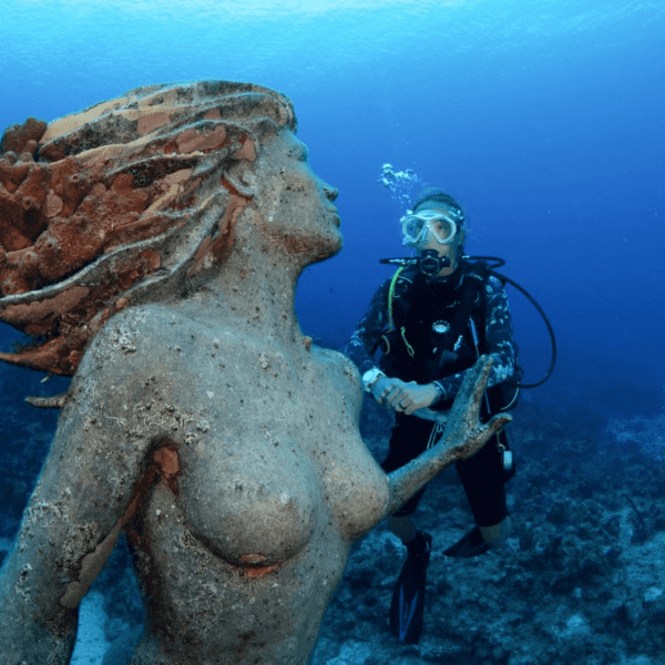 Mermaid statue under water